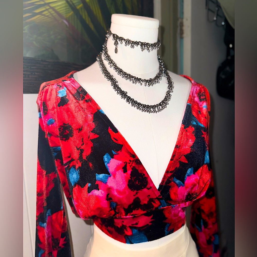 Beautiful velvety floral long sleeve cropped blouse with a deep V-Line.